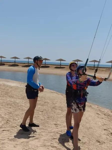 Students learning kite control with their instructor