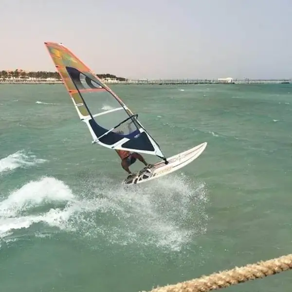 Windsurfer jumping a wave