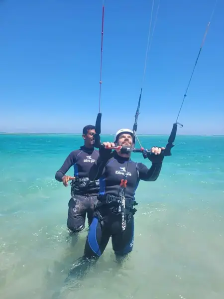 Instructor teaching kite control in the water