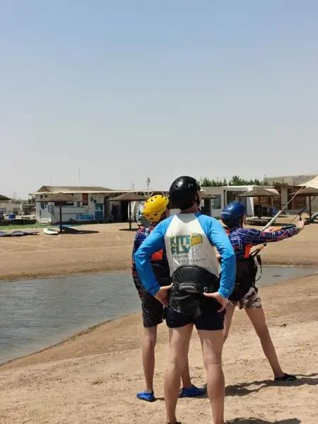 Instructor and students watching the kite